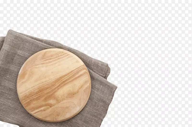 棕色木质纹理抹布上面的圆木盘实