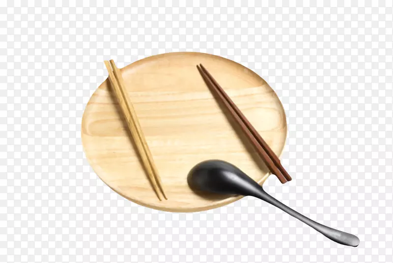 棕色木质纹理放着黑色勺子和筷子