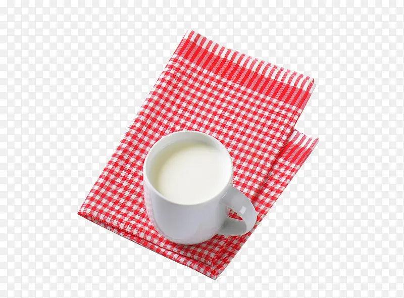 餐桌布上的牛奶杯