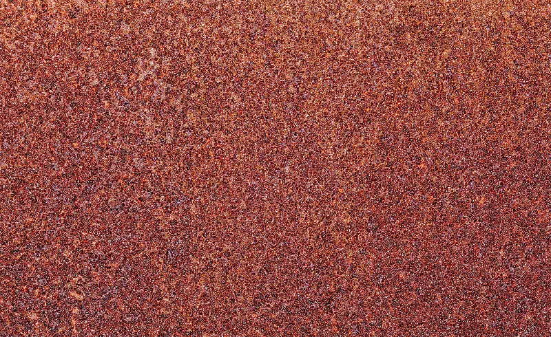 红褐色点状金属锈蚀脱落背景纹理