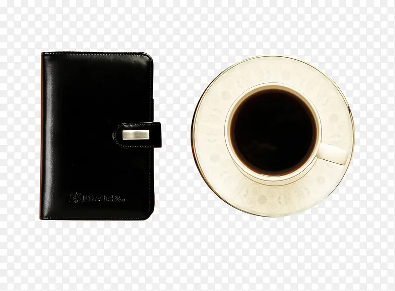 黑色笔记本和咖啡杯