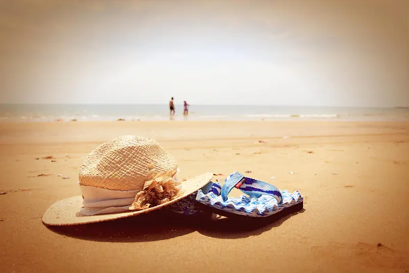 沙滩上的鞋帽海报背景