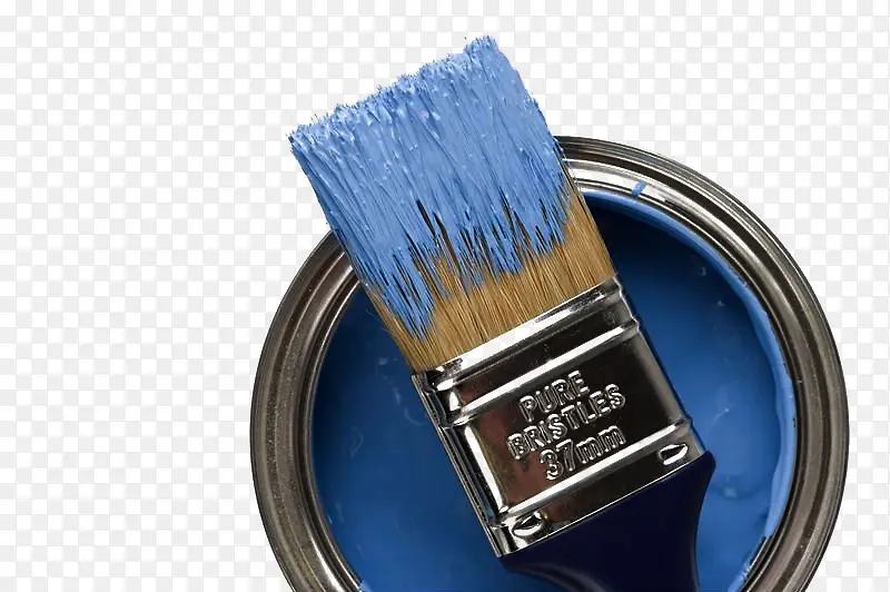 蓝色油漆桶和沾着油漆的刷子