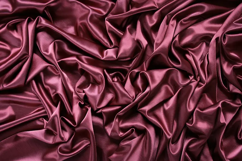 紫红色丝绸布料护肤品背景