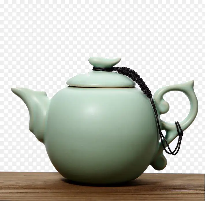 桌上的青瓷茶壶
